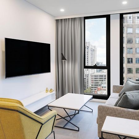 Meriton Suites 멜번 외부 사진 A living room