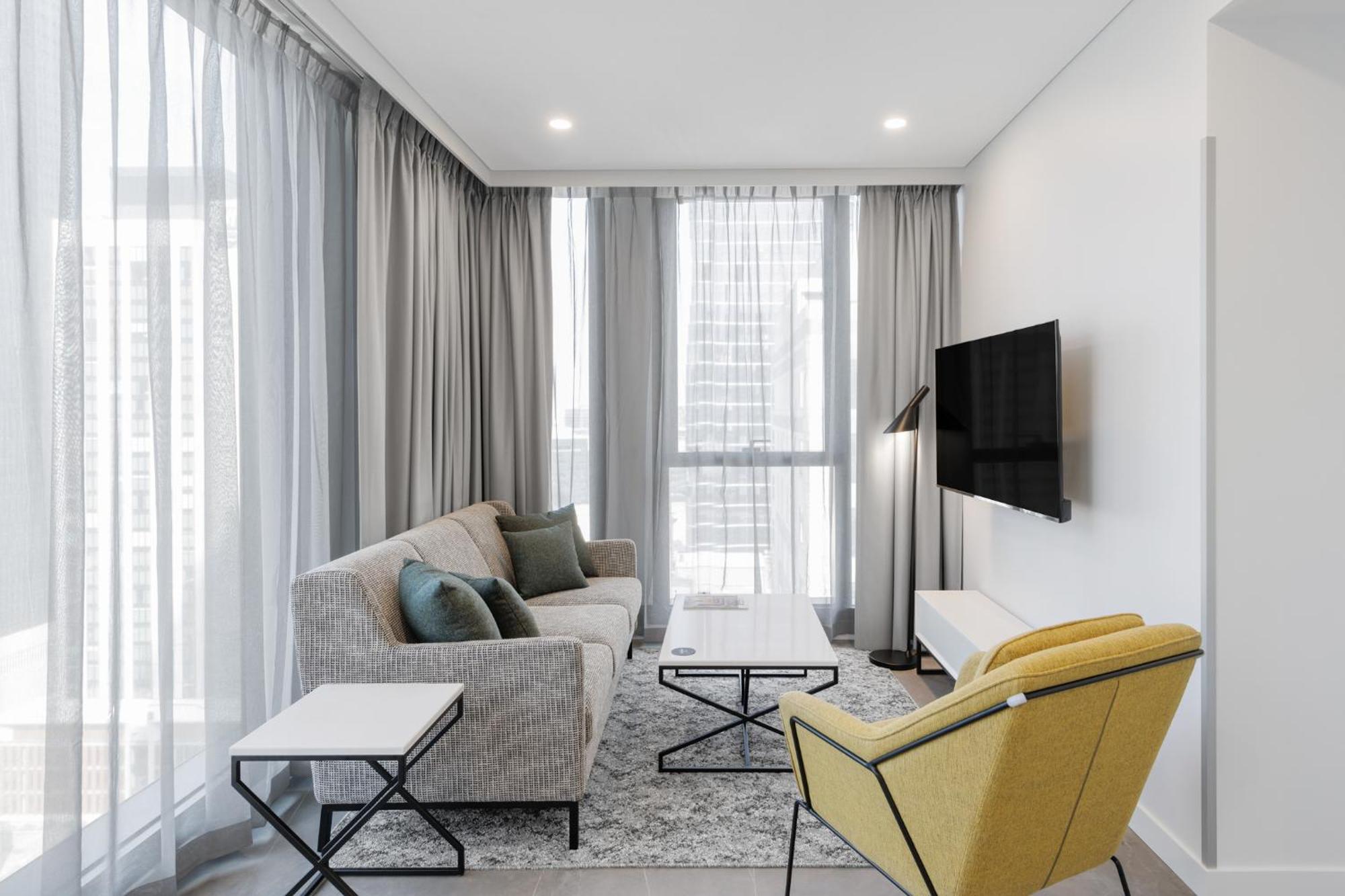 Meriton Suites 멜번 외부 사진 A living room in a typical apartment